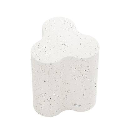 Top-down angled shot of Terrazzo Odalys concrete side table, highlighting its distinctive wavy shape