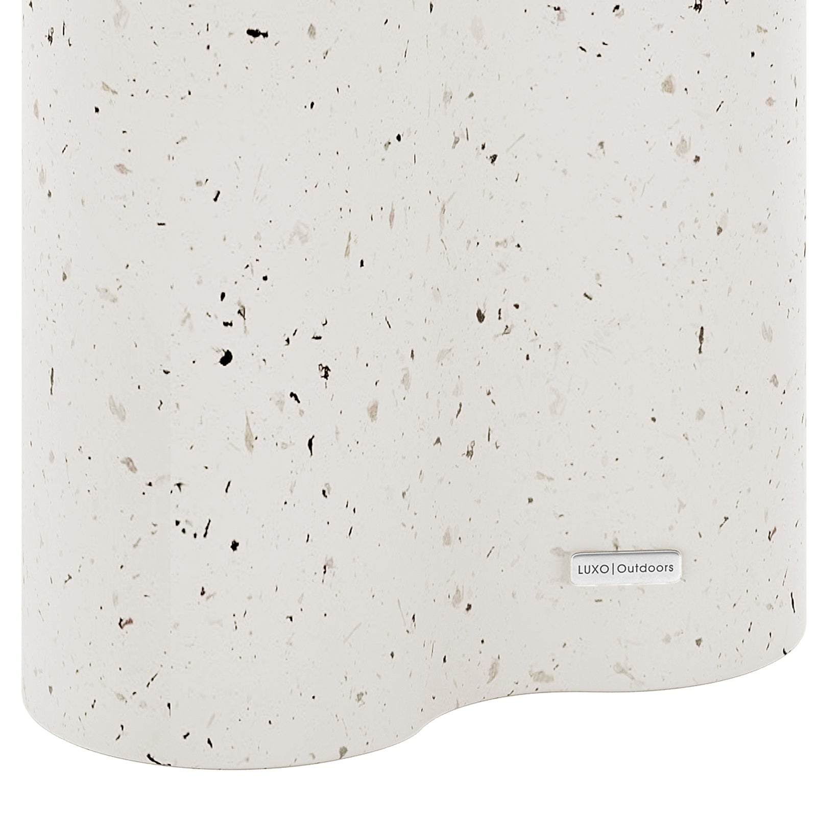 Detail shot of the Odalys Terrazzo concrete side table surface, featuring the Luxo Outdoors tag