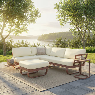Paloma Modular Outdoor Lounge Set in Terracotta, featuring an L-shaped sectional with off-white cushions and a matching ottoman, set on a natural-fiber rug beside a serene lakeside view.