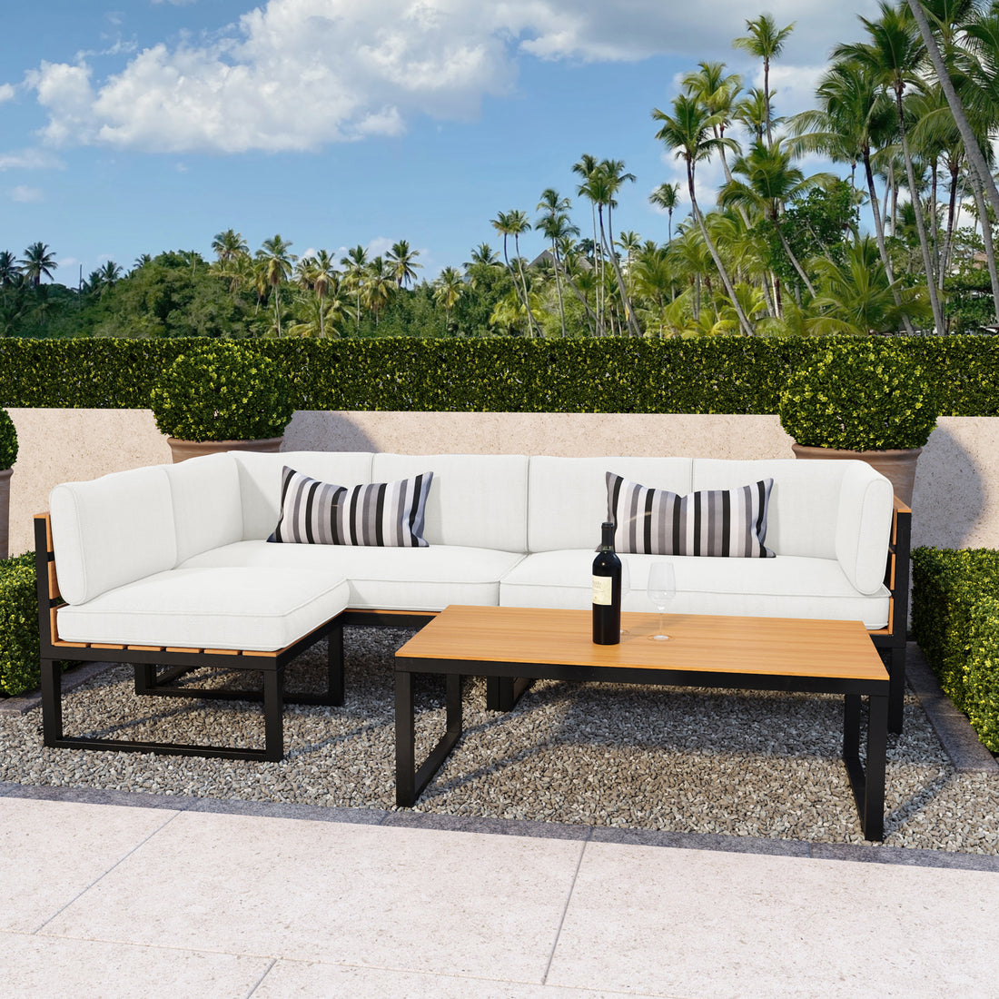 Panaluu 5-Seater Aluminium Corner Outdoor Lounge Set featuring a sleek, sturdy aluminium frame and plush cushions, elegantly arranged in an outdoor setting with palm trees and a cozy, inviting vibe.