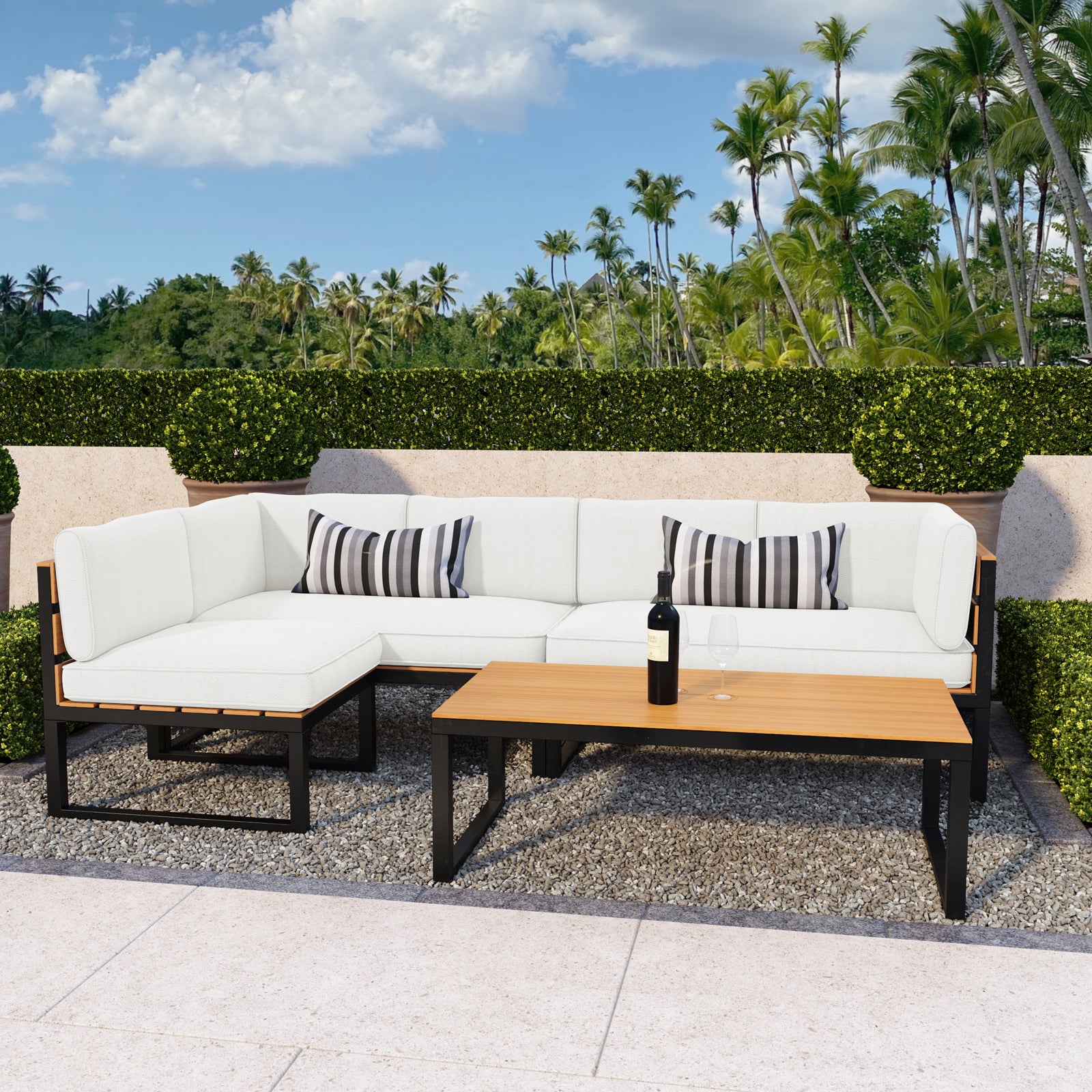 Panaluu 5-Seater Aluminium Corner Outdoor Lounge Set featuring a sleek, sturdy aluminium frame and plush cushions, elegantly arranged in an outdoor setting with palm trees and a cozy, inviting vibe.