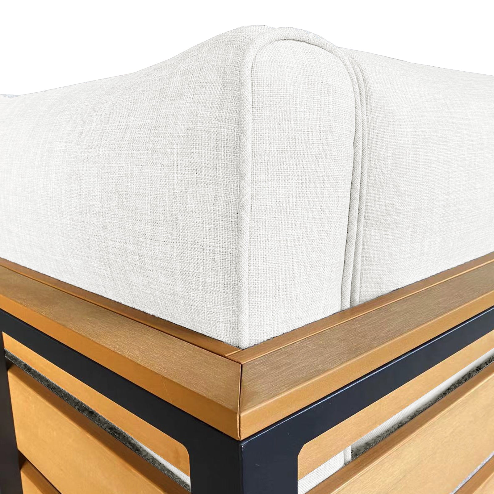 Close-up of the Panaluu 5 Seater Aluminium Corner Outdoor Lounge in White, featuring a thick upholstered cushion with seam piping on a light wood slat and black metal frame.