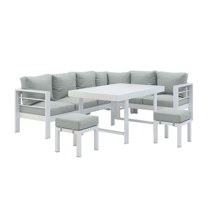 Portland Outdoor Corner Sofa Lounge with Footstools, showcasing plush cushions on a sturdy frame. A glimpse of the matching coffee table emphasizes its cohesive design, perfect for stylish outdoor relaxation.