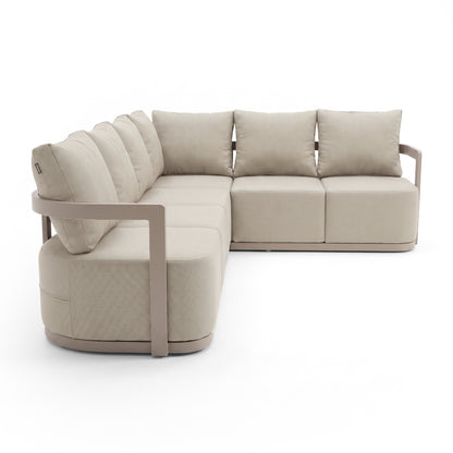 Modern beige L-shaped sectional sofa on a white studio background