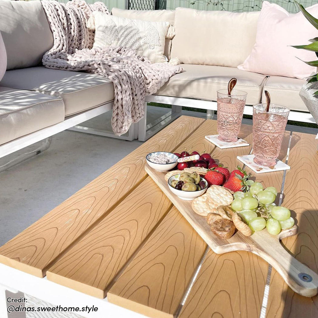 Rosa 5 Seater Outdoor Corner Sofa Lounge with Coffee Table showcasing sleek modern design, featuring plush cushions and a stylish low-profile coffee table, set in a cozy outdoor arrangement with snacks and drinks.