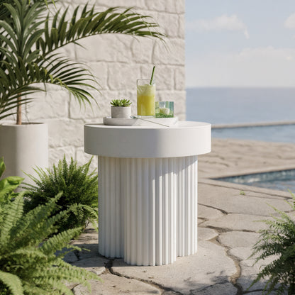 Salvo 38cm Outdoor Concrete Coffee Side Table in White, featuring a fluted cylindrical base, round top, and minimalist setup with a succulent, green drink, and lush tropical surroundings.