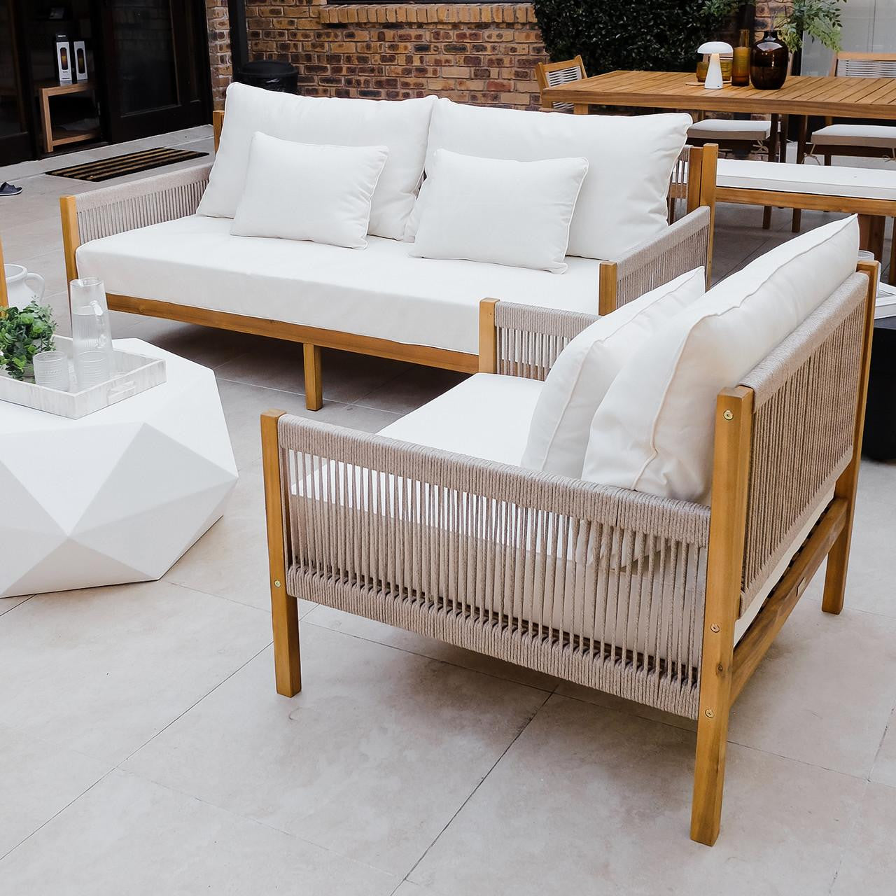 Savin 4-Seater Hardwood Outdoor Sofa Set in Beige, featuring a wooden sofa and armchair with off-white cushions, paired with a geometric coffee table. Perfect for enhancing any outdoor living space.