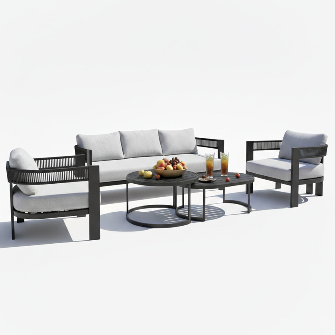 Sorrelle 5-Seater Curved Outdoor Sofa Set in Black features a three-seat sofa, two armchairs with light gray cushions, and two nested coffee tables with fruit and iced tea displayed.