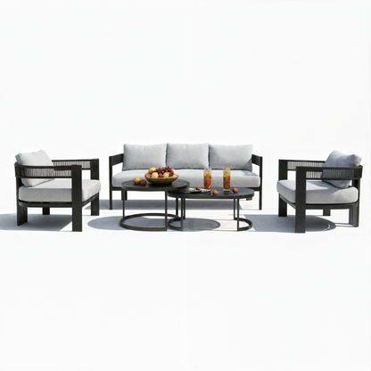 Sorrelle 5-Seater Curved Outdoor Sofa Set in Black, featuring light gray cushioned armchairs, a matching sofa, and two nesting coffee tables with fruit and drinks, arranged for a stylish patio setting.