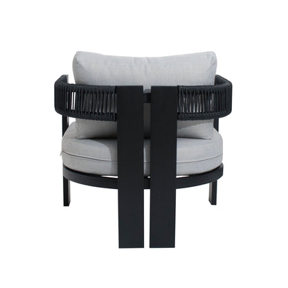 Modern lounge chair from Sorrelle 5 Seater Wicker Outdoor Sofa Set in Black, featuring a round seat, low back, black metal frame, woven rope detail, and thick light-gray cushions.