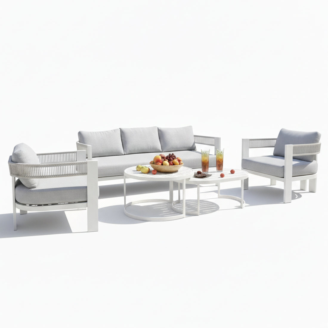 Sorrelle 5-Seater Curved Outdoor Sofa Set in Light Grey features a three-seat sofa, two armchairs, and nested coffee tables with fruit and drinks, creating a cozy outdoor setting.