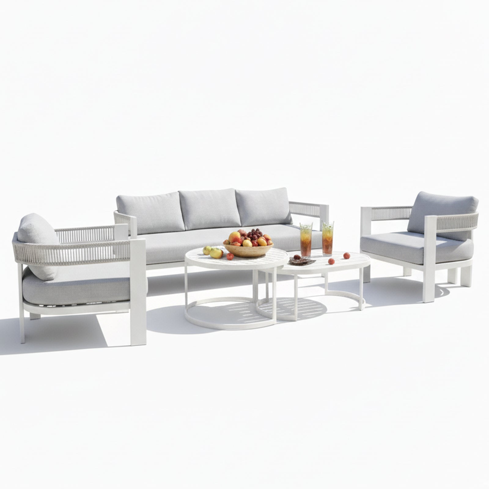 Sorrelle 5-Seater Curved Outdoor Sofa Set in Light Grey features a three-seat sofa, two armchairs, and nested coffee tables with fruit and drinks, creating a cozy outdoor setting.