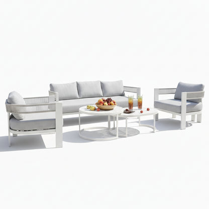 Sorrelle 5-Seater Curved Outdoor Sofa Set in Light Grey features a three-seat sofa, two armchairs, and nested coffee tables with fruit and drinks, creating a cozy outdoor setting.