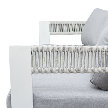 Close-up of Sorrelle 5 Seater Wicker Outdoor Sofa Set armrest, featuring a white metal frame with woven rope and light-gray fabric cushions, highlighting its modern design and outdoor durability.