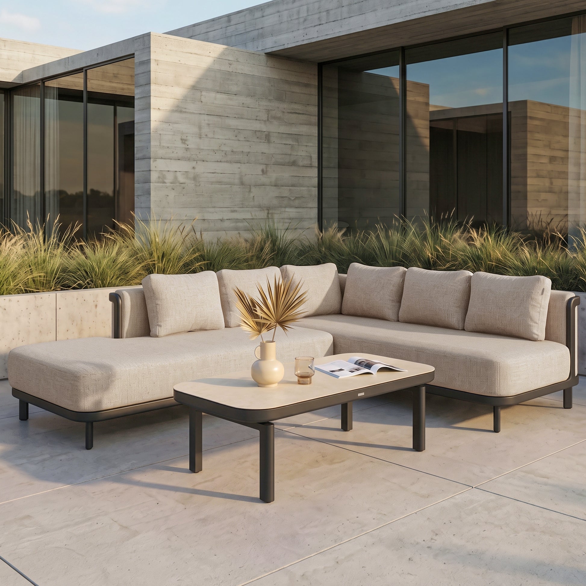 Outdoor sectional sofa and coffee table styled on a modern patio.