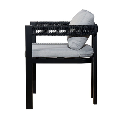 Tavari 6-Seater Aluminium Outdoor Dining Set in Black features a modern armchair with a black metal frame, woven rope detailing, and light-gray cushions, showcasing its contemporary and minimal design.