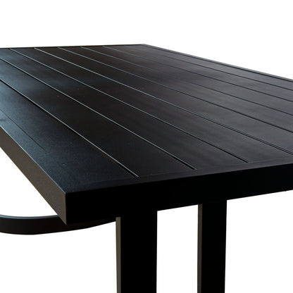 Tavari 6-Seater Aluminium Outdoor Dining Set in Black features a matte-black tabletop with narrow grooves, beveled edges, and sturdy legs, showcasing modern design ideal for outdoor settings.