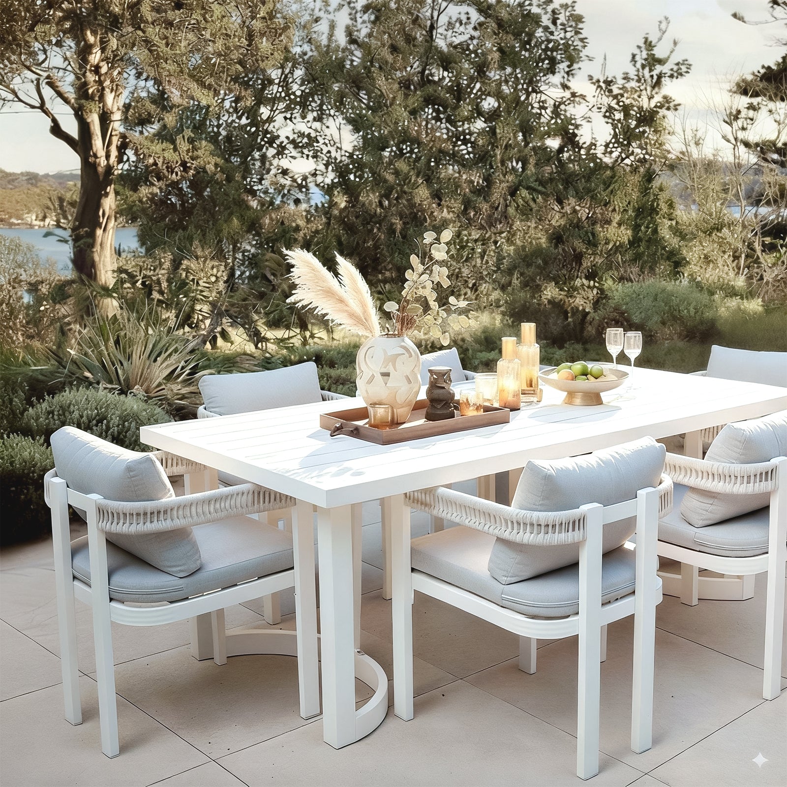 Tavari 208cm 6-Seater Curved Outdoor Dining Set in Light Grey, featuring a white table with matching armchairs, woven rope backs, and light grey cushions, set for stylish outdoor entertaining.