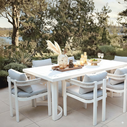 Tavari 208cm 6-Seater Curved Outdoor Dining Set in Light Grey, featuring a white table with matching armchairs, woven rope backs, and light grey cushions, set for stylish outdoor entertaining.