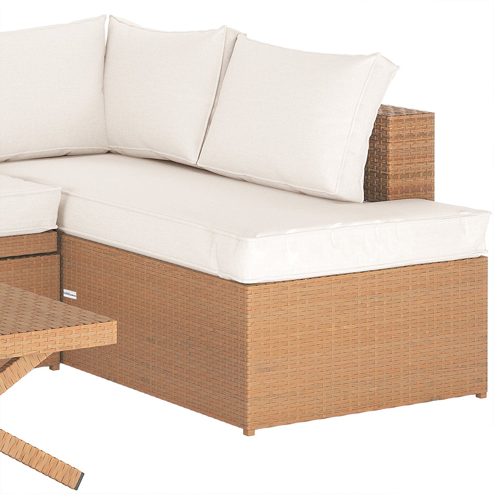 Tybee 4 Seater Rattan Outdoor Sofa Set in Cream White features a wicker corner piece with off-white cushions, adjacent to a matching coffee table leg, showcasing its stylish and modular design.