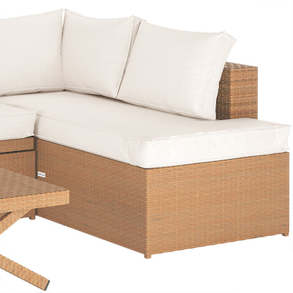 Tybee 4 Seater Rattan Outdoor Sofa Set in Cream White features a wicker corner piece with off-white cushions, adjacent to a matching coffee table leg, showcasing its stylish and modular design.