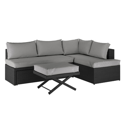 Tybee 4 Seater Rattan Outdoor Corner Sofa Set in Warm Grey, featuring a modular L-shaped black wicker design with light-grey cushions, paired with a matching ottoman topped with a cushion.