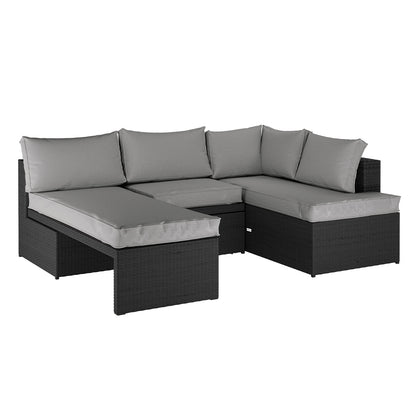 Tybee 4 Seater Rattan Outdoor Corner Sofa Set in Warm Grey features a modular L-shaped design with a black wicker base, light gray cushions, and a chaise lounge configuration.