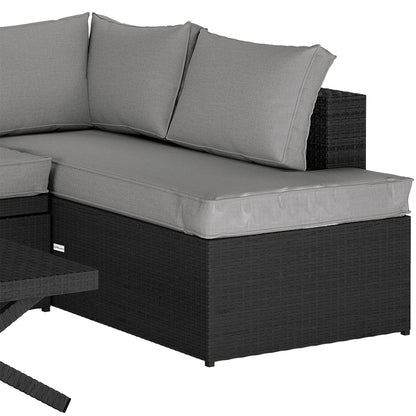 Tybee 4 Seater Rattan Outdoor Corner Sofa Set in Warm Grey, showcasing a modular black rattan base with light-gray cushions, includes a corner piece with a matching low table partially visible.