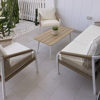 Vernon 5 Seater Aluminium Outdoor Sofa Set in Cream White featuring sleek white metal frames, woven rope sides, light-cream cushions, and a slatted wood-tone coffee table with a potted plant.