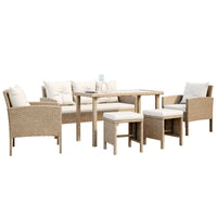 Vero 7 Seater Wicker Outdoor Sofa Dining Set, highlighting the intricate wicker design on the chair armrest, plush pillow, and sturdy footstool for a cozy outdoor setup.