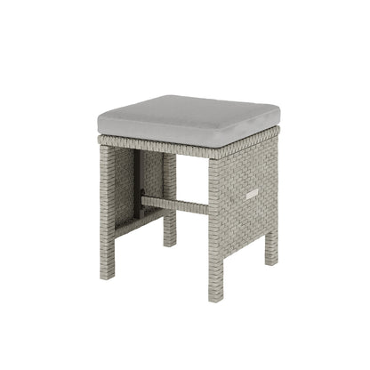 Vero 7 Seater Wicker Outdoor Sofa Dining Set Warm Grey features a stool with a cushioned seat, highlighting its versatile and modern design suitable for outdoor relaxation and dining.