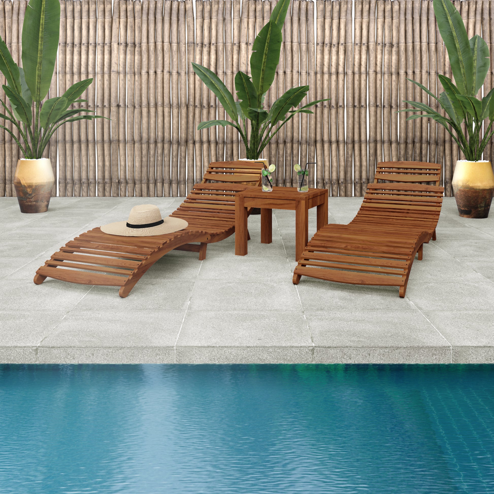 Wave Hardwood Acacia Outdoor Sun Loungers Set of 2 in Natural, featuring curved designs on a tiled deck with a side table, iced drinks, a straw hat, and tropical plants in the backdrop.