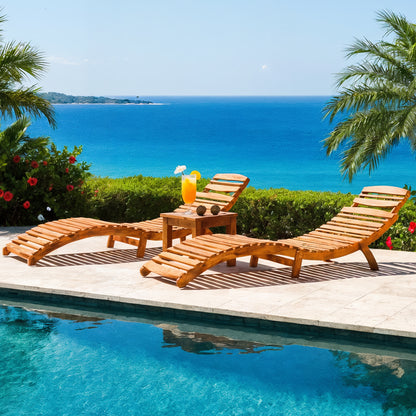 Wave Hardwood Acacia Outdoor Sun Loungers Set of 2 in Natural on a stone deck, featuring curved wooden design, accompanied by a matching side table with a tropical drink and coconuts, ocean backdrop.