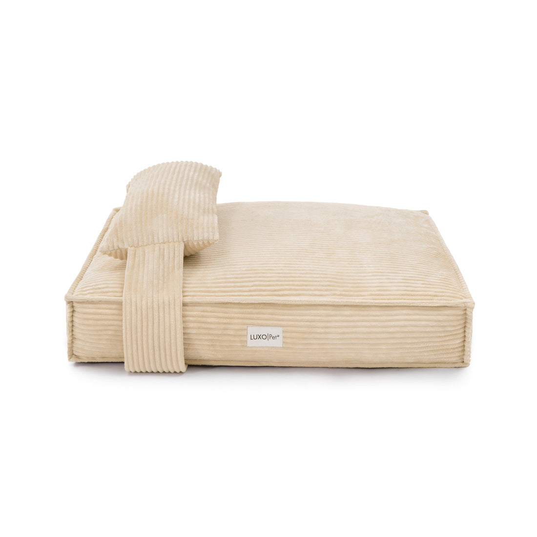Dax Medium Corduroy Dog Bed – Soft & Stylish Beige: Close-up view highlights plush corduroy fabric and supportive bolstered sides, showcasing its luxurious design and comfort features for pet relaxation.
