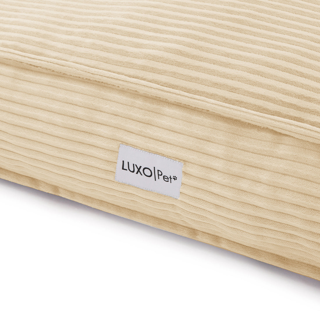 Dax Medium Corduroy Dog Bed – Soft & Stylish Beige, featuring close-up views of the corduroy texture, plush cushioning, and a label, showcasing its cozy and modern design for pets.