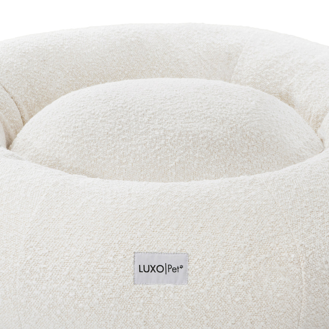 Kyra Large Boucle Pet Bed – Light Beige Plush Comfort, featuring a close-up of plush raised bolsters in soft boucle fabric, designed for ergonomic support and modern style.