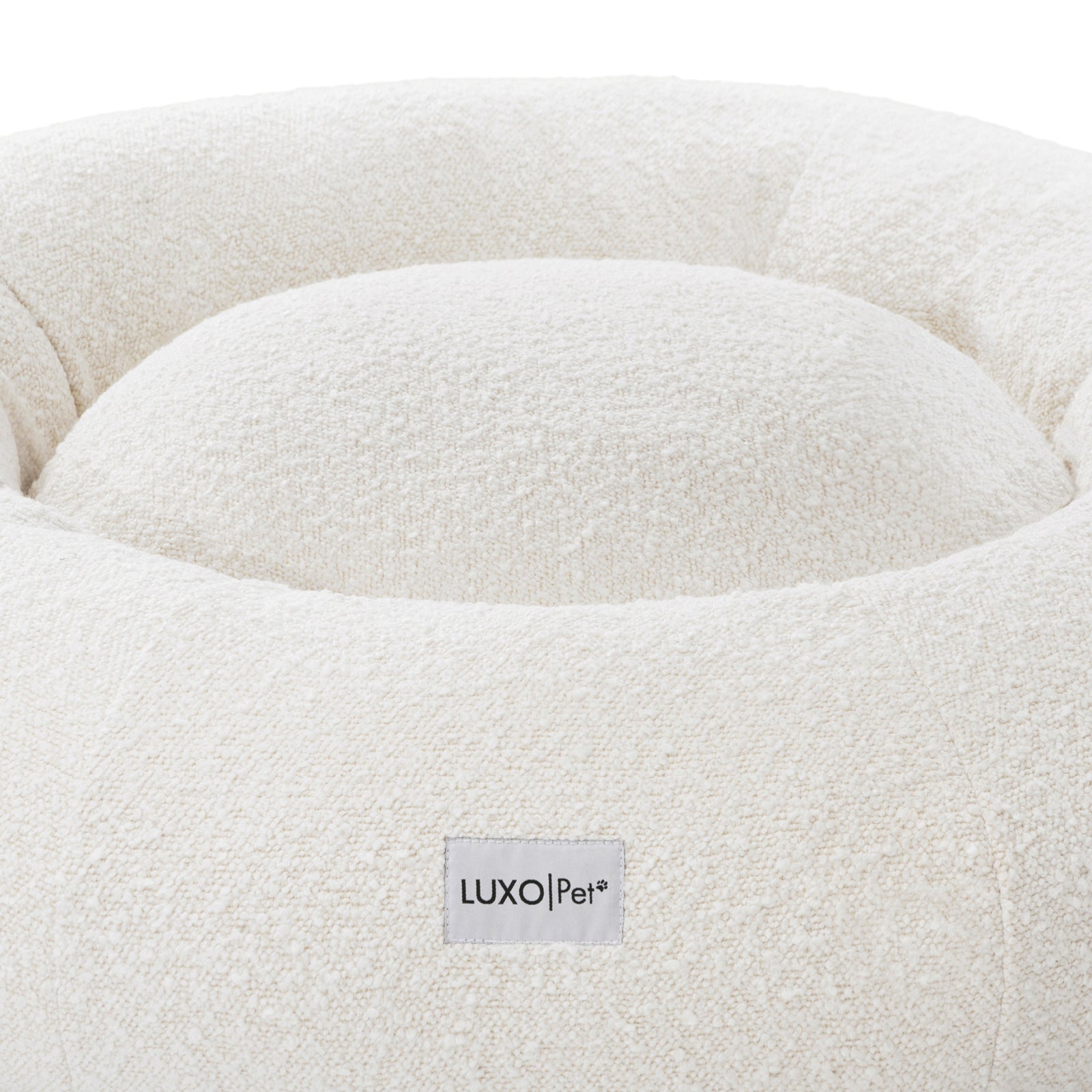 Kyra Large Boucle Pet Bed – Light Beige Plush Comfort, featuring a close-up of plush raised bolsters in soft boucle fabric, designed for ergonomic support and modern style.
