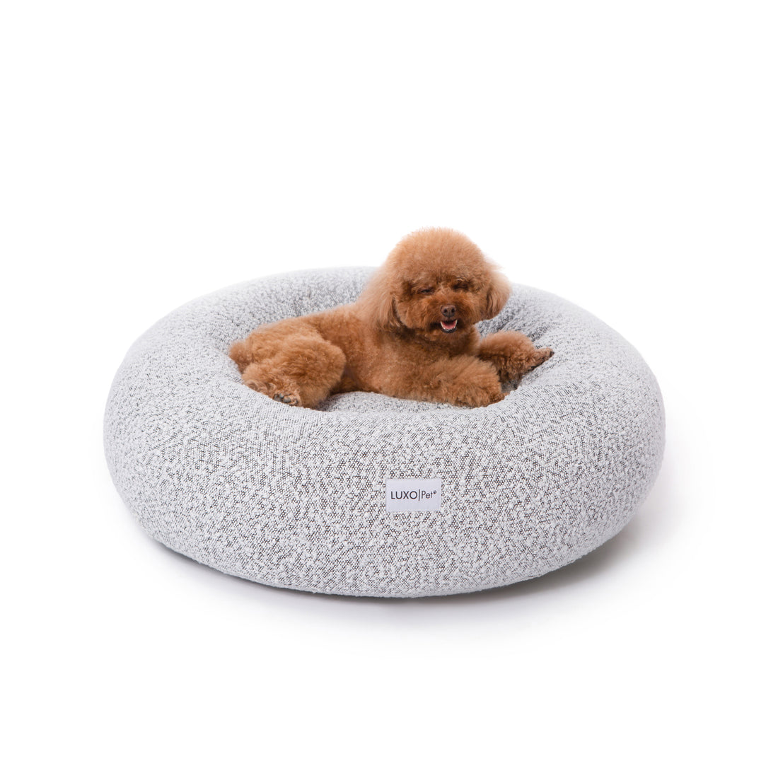 Close-up of the Kyra Medium Boucle Pet Bed – White with Black Base, featuring plush raised bolsters and a luxurious white boucle texture, offering ergonomic support for pets.