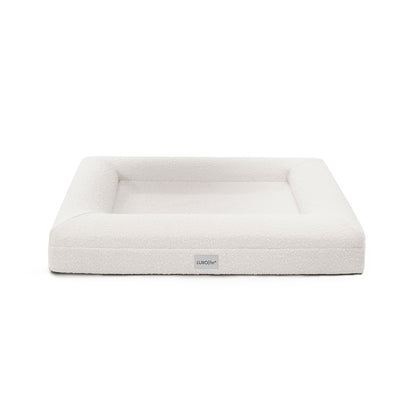 Tyro Luxe Medium Orthopedic Pet Bed – Light Beige features a dual-layer orthopedic foam core with soft boucle fabric, highlighted by a subtle logo, designed for joint support and style.