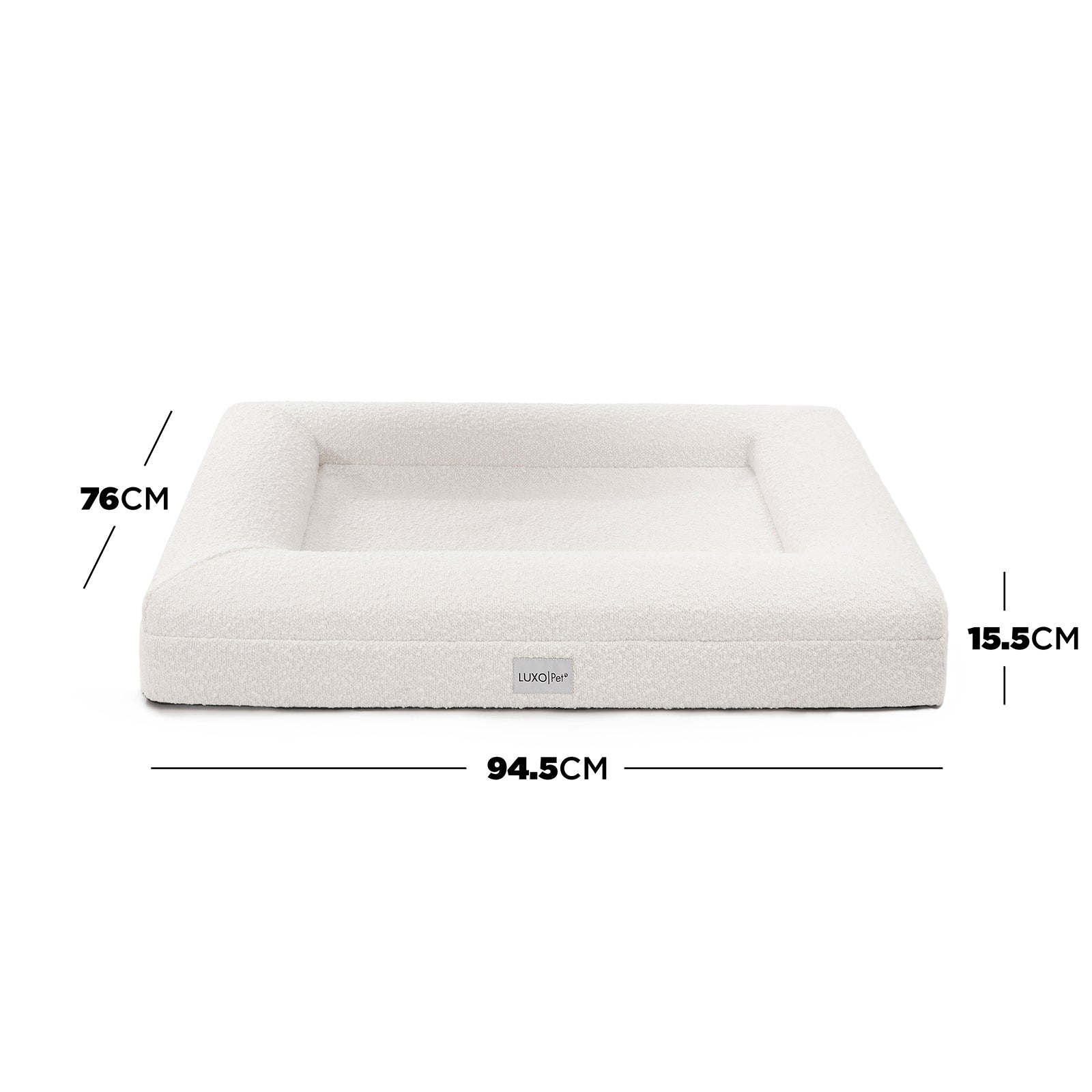 Tyro Luxe Medium Orthopedic Pet Bed – Light Beige; close-up of a plush, textured surface with a subtle logo, highlighting its supportive structure and premium fabric designed for pet comfort.