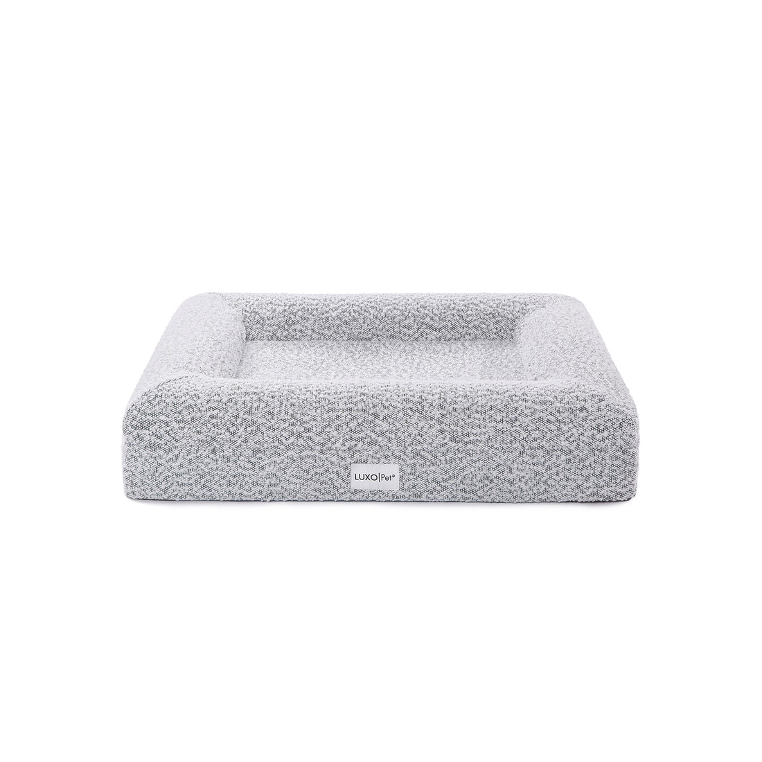 Tyro Luxe Small Orthopedic Pet Bed – Black & White, featuring a close-up of its soft boucle fabric and high-density memory foam base, designed for joint support and modern home aesthetics.
