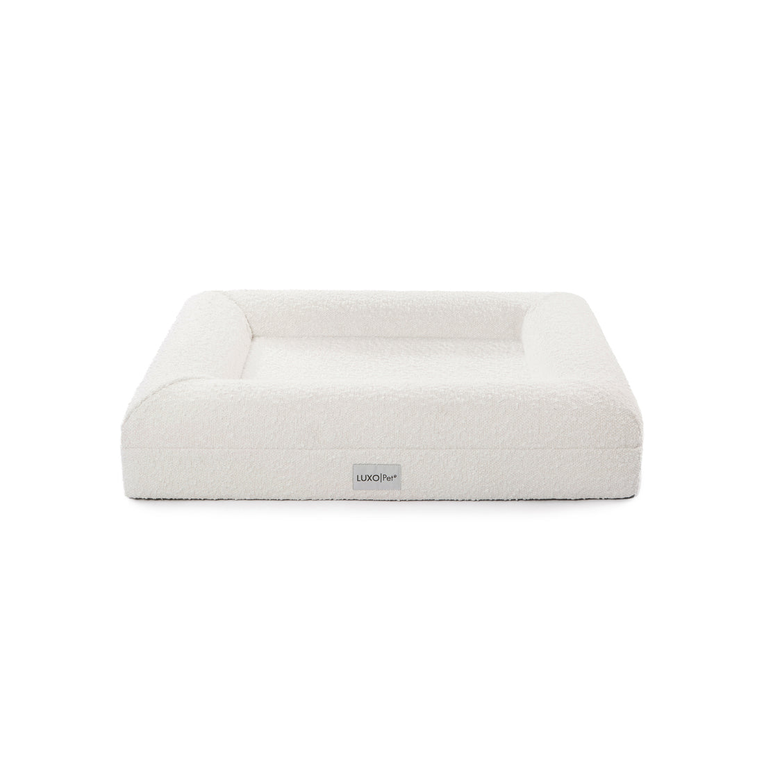 Tyro Luxe Small Orthopedic Pet Bed with dual-layer memory foam, boucle cover, and anti-slip base, designed for small pets. Showcased in a simple, elegant setting with a white background.