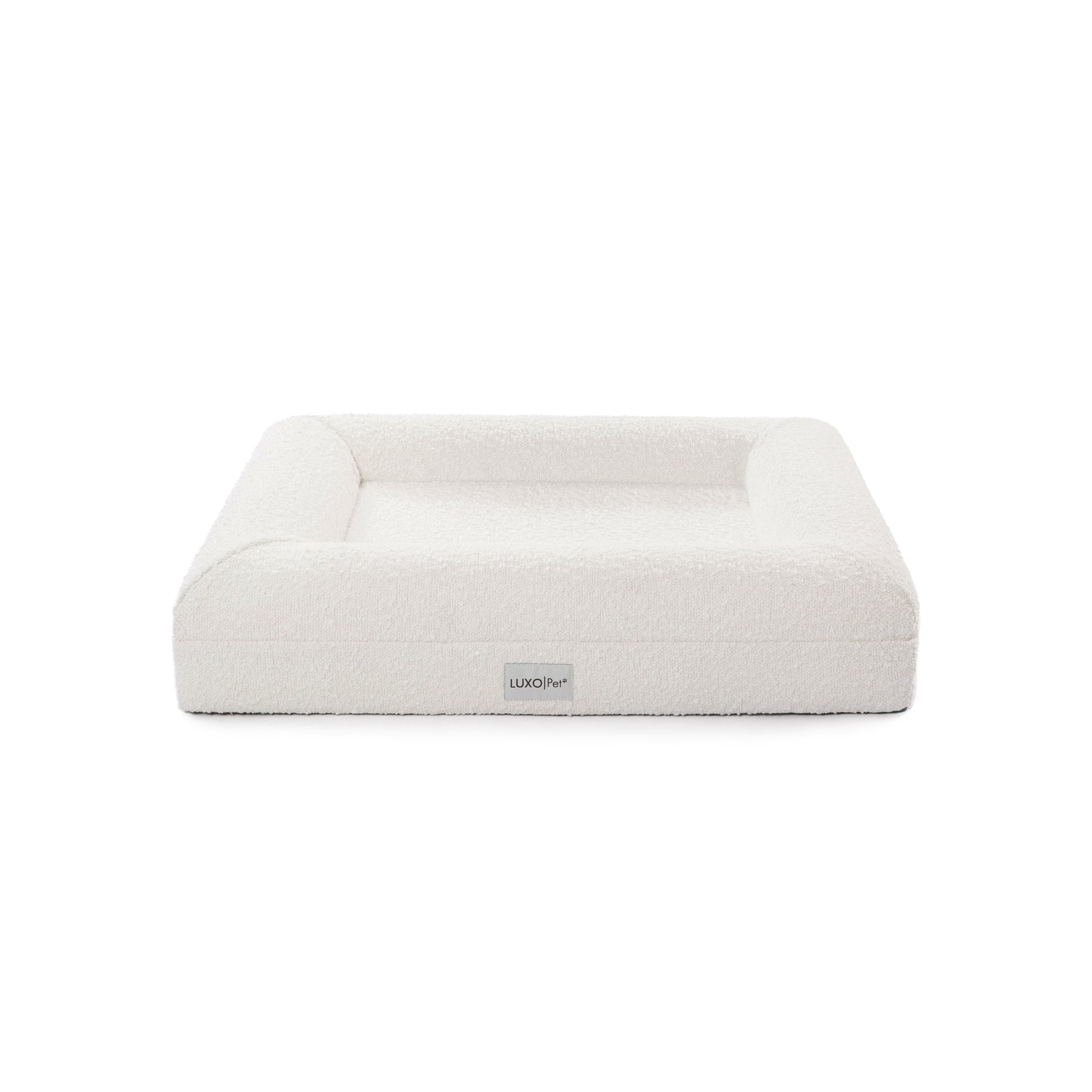 Tyro Luxe Small Orthopedic Pet Bed with dual-layer memory foam, boucle cover, and anti-slip base, designed for small pets. Showcased in a simple, elegant setting with a white background.