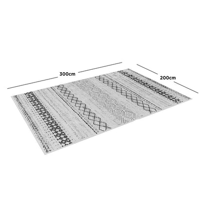 Alyne 200x300 Indoor Contemporary Large Floor Rug with a tribal-inspired design featuring light and dark geometric stripes and diamond motifs, displayed flat with dimension lines highlighting its size.