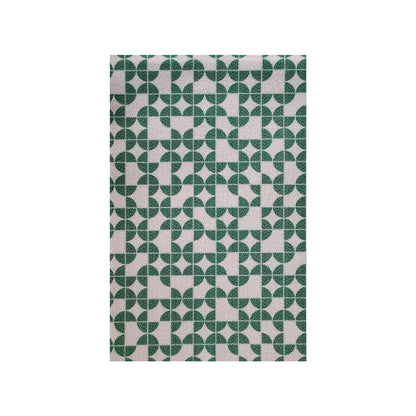 Angell 60x90cm Modern Outdoor Floor Doormat in Teal showcases a geometric pattern of dark-green quarter-circles and semi-circles on a light-beige background, forming circular and star-like motifs.