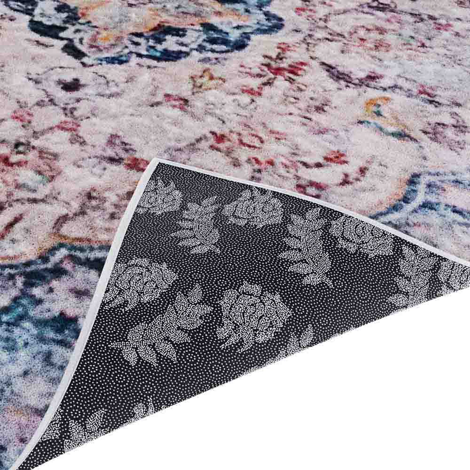 Ariza 120x170cm Small Persian Silky Indoor Floor Rug with a muted abstract floral pattern. One corner is flipped up showing its dark anti-slip backing with a dotted floral grip.