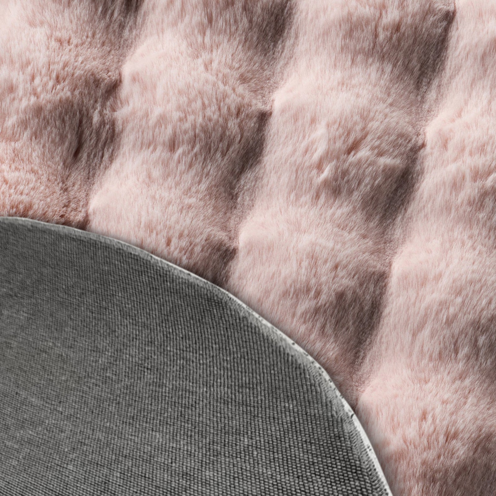 Armida 160cm Round Fluffy Faux Fur Bubble Rug in Dusty Pink, featuring a plush tufted surface with a folded-back corner revealing a gray non-slip backing, perfect for adding cozy luxury.