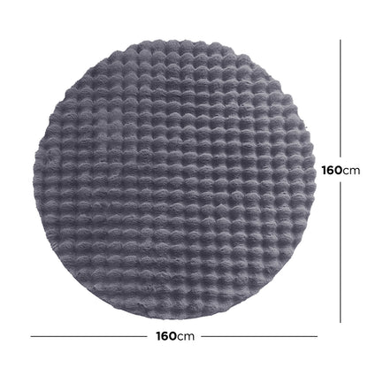 Armida Grey Round Faux Fur Bubble Rug 160cm features a plush, dark gray, round design with a subtle waffle texture, enhancing its luxurious appearance against a white background, highlighting its 160 cm diameter.