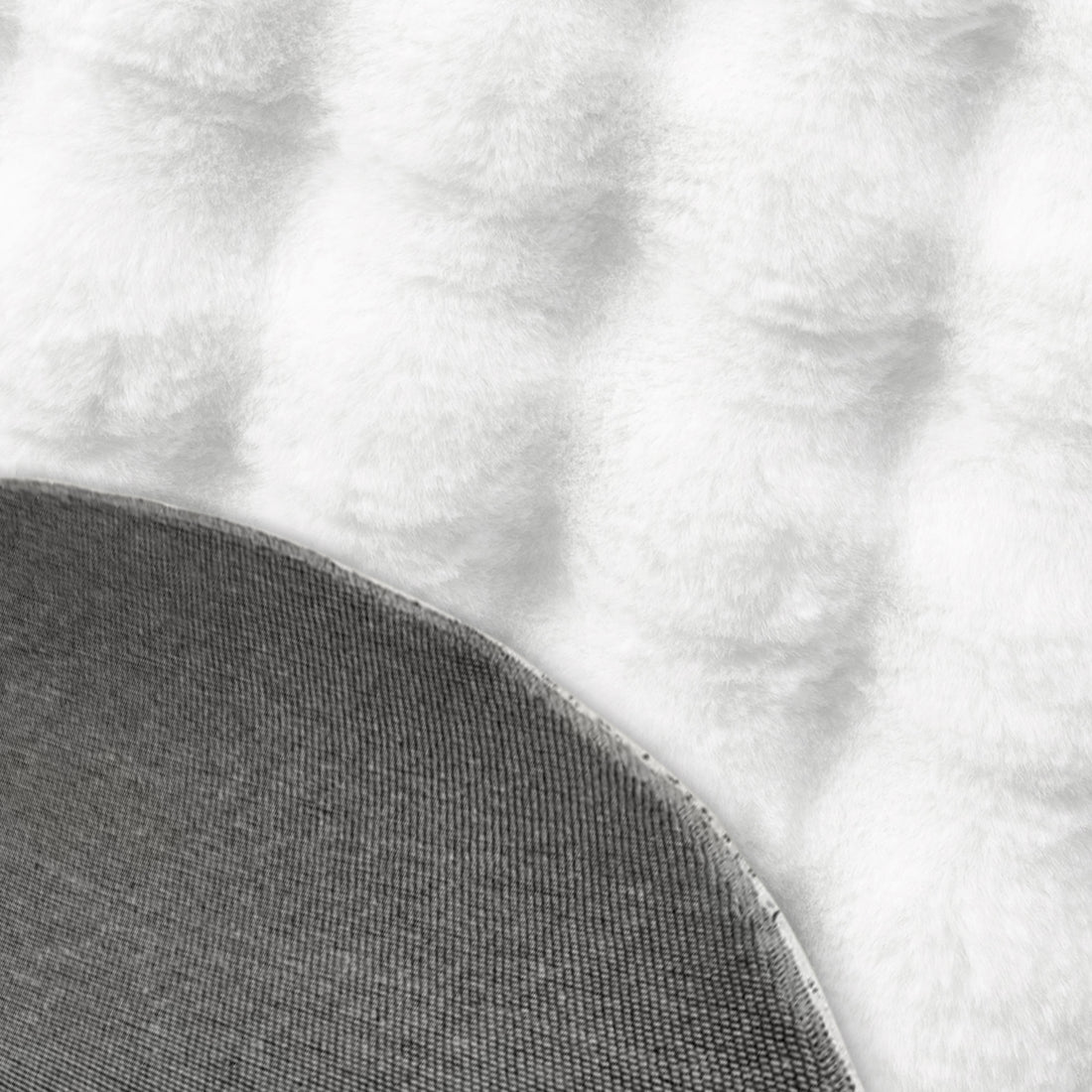 Close-up of the Armida 160cm Round Fluffy Faux Fur Bubble Rug in White, showcasing its soft, fluffy pile and grey, textured non-slip backing, emphasizing its luxurious and practical design.