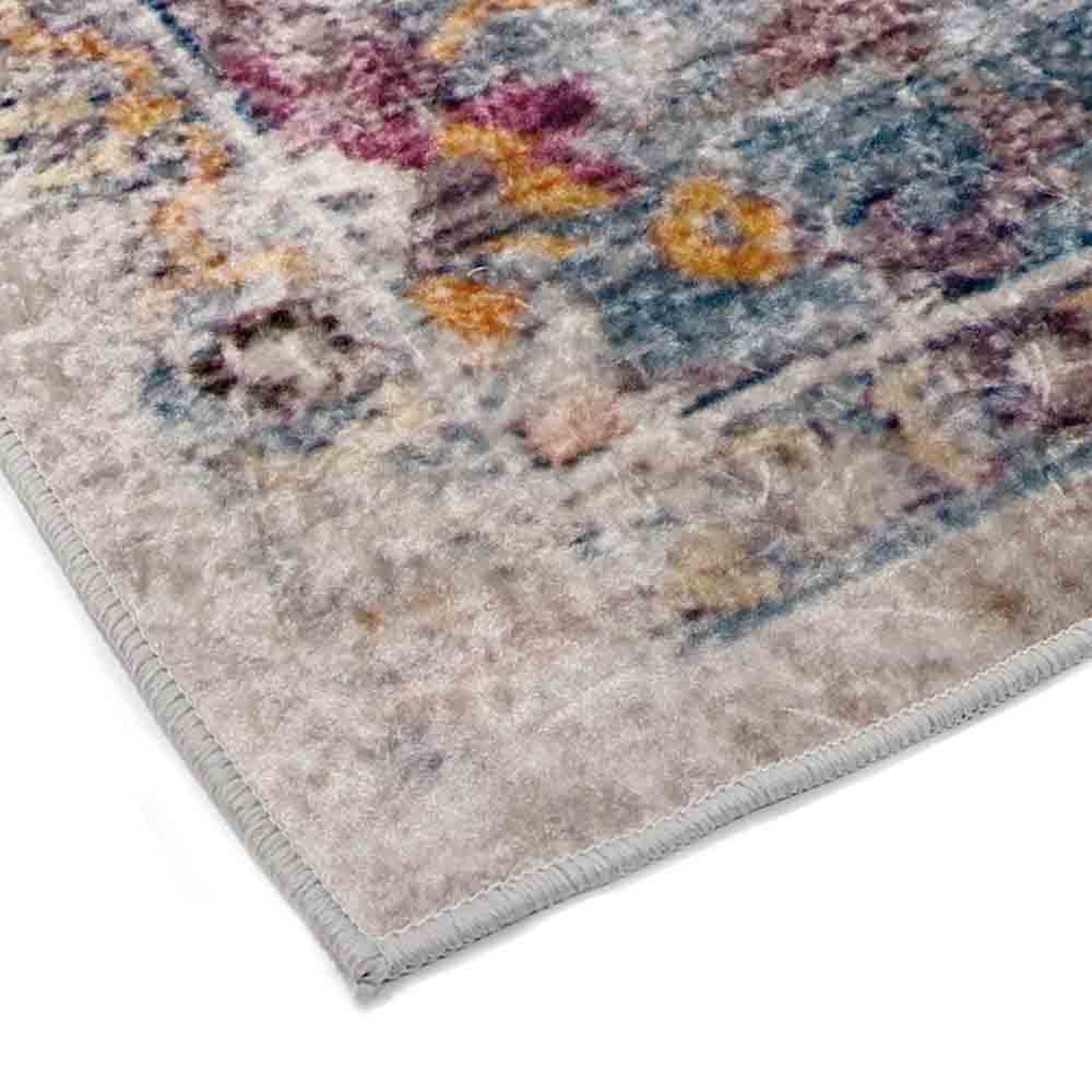 Close-up of the Arwani 160x230cm Medium Traditional Persian Indoor Rug, showcasing its distressed vintage pattern with overlapping floral and geometric motifs in muted tones, and a neatly serged light gray edge.